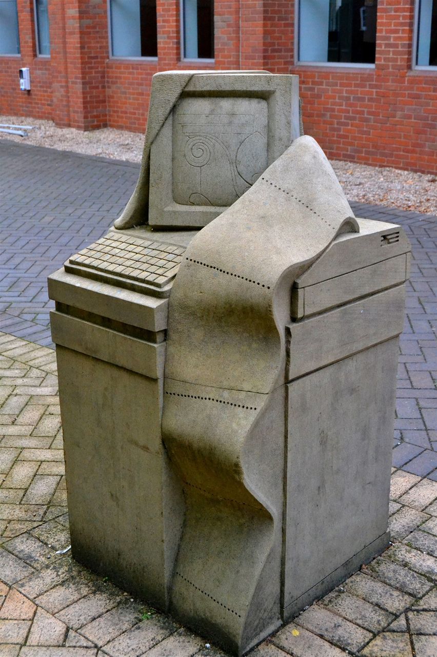 The Broadway. In courtyard of College Objects of technology in York stone designed by Steve Field, sculpted by John Vaughan