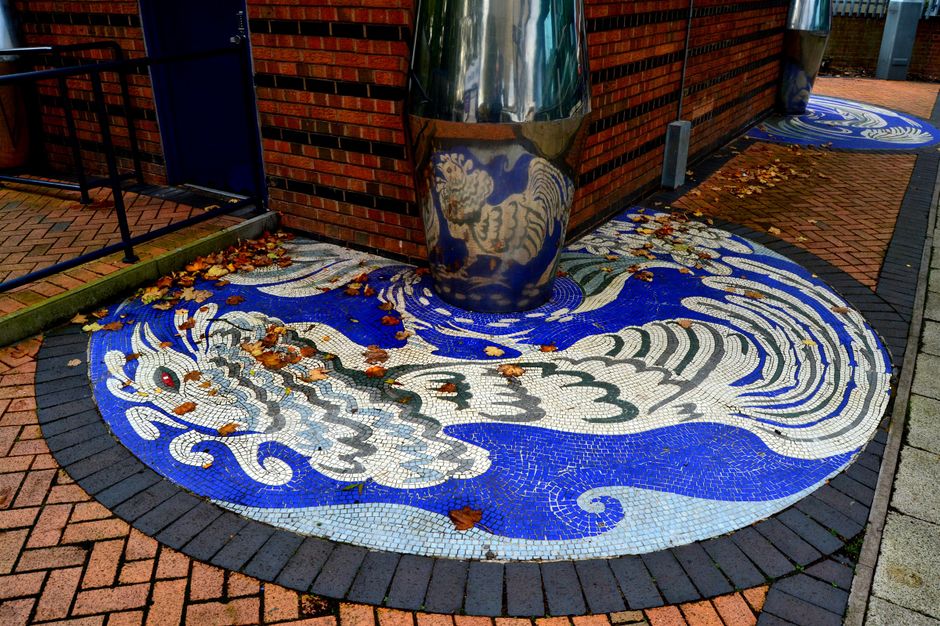 Anamorphic mosaics at bus station, designed by Steve Field.1994, laid by Ilona Bryan and Chris Willetts
