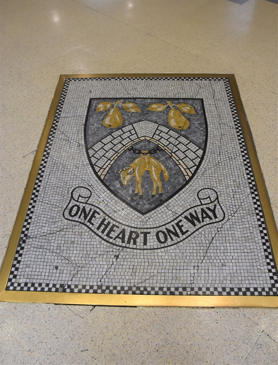 Borough arms cut into the floor of the Crown Centre